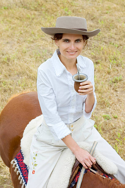 Argentinean Gaucha on her Horse stock photo