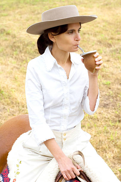 Argentinean Gaucha on her Horse stock photo