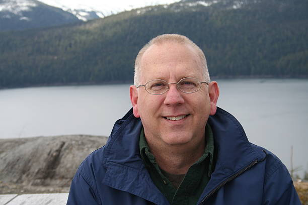 istock Smiling Senior Outdoors on Alaska Vacation 92868458