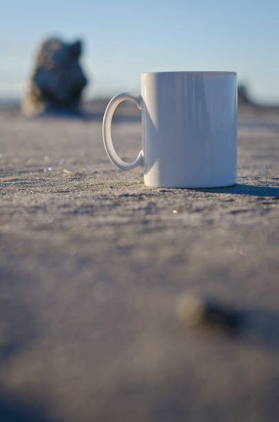 istock Blank white coffee mug on the ground 928685620
