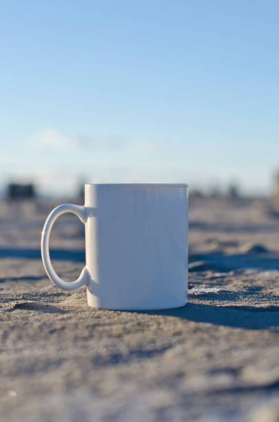 istock Long solo lank white coffee mug at sunset 928685638