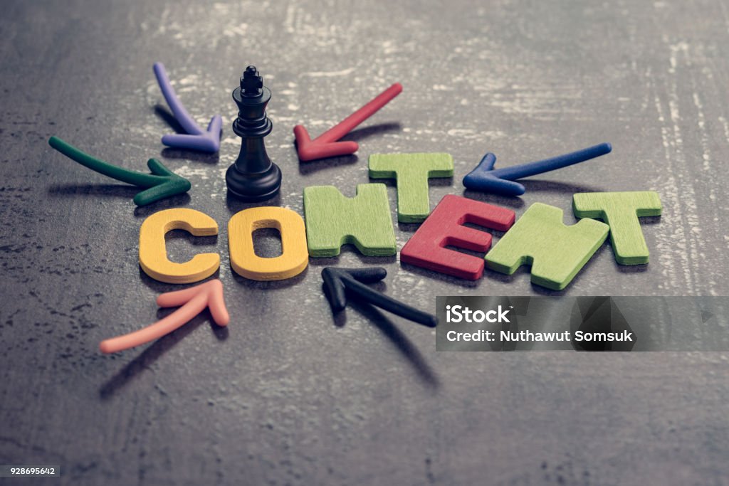 Content is king in advertising and communication concept, colorful arrows pointing to the word CONTENT at the center with chess king on black cement wall, creativity of brand website and social media Content is king in advertising and communication concept, colorful arrows pointing to the word CONTENT at the center with chess king on black cement wall, creativity of brand website and social media. Contented Emotion Stock Photo