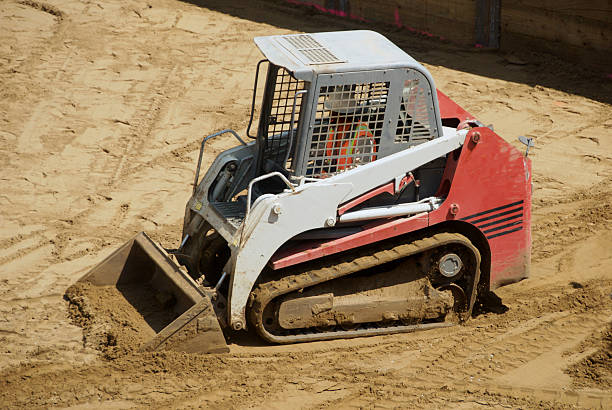 Mini Excavator on Construction Site stock photo