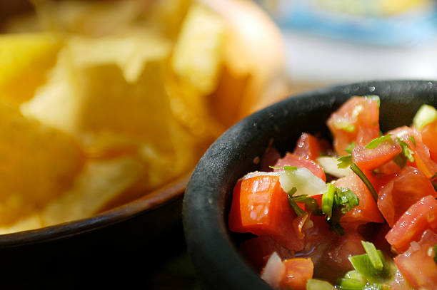 Bowl of salsa and tortilla chips at Mexican Restaurant stock photo