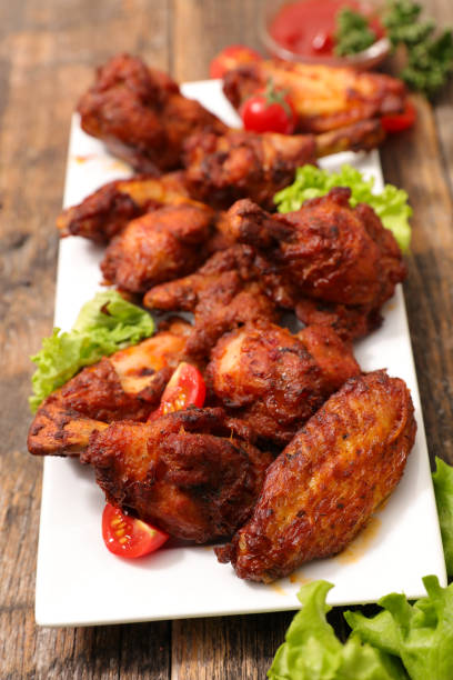 istock fried barbecue chicken wings and leg 928696786