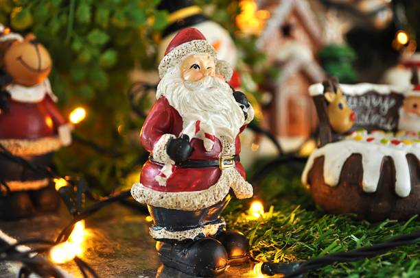 istock Santa Claus doll with Christmas Decorations for background 928701926
