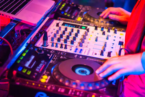 istock DJs are turntablism turntables plate mixer night party pub Motion blur abstract background. 928701988