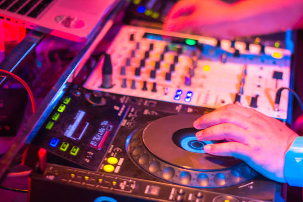 istock DJs are turntablism turntables plate mixer night party pub Motion blur abstract background. 928701992