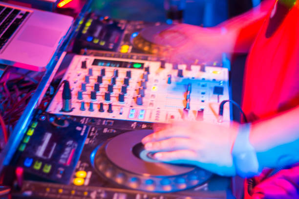 istock DJs are turntablism turntables plate mixer night party pub Motion blur abstract background. 928701994