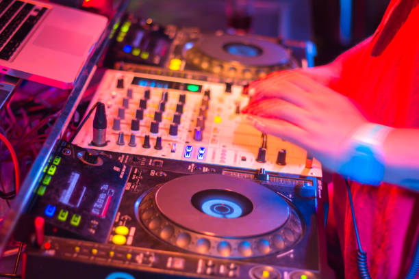 istock DJs are turntablism turntables plate mixer night party pub Motion blur abstract background. 928702010
