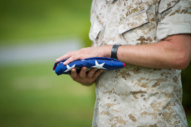 US Military Marines passing US flag