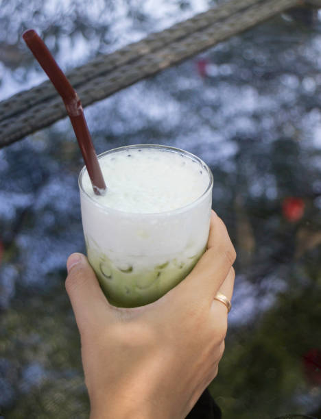 istock Hand on green tea iced glass 928712906