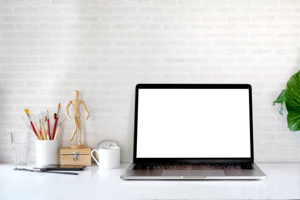 istock Laptop computer mockup with blank screen, gadgets and supplies on designer desk 928717570
