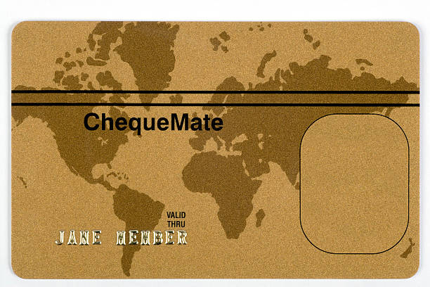 Gold credit card with world map stock photo