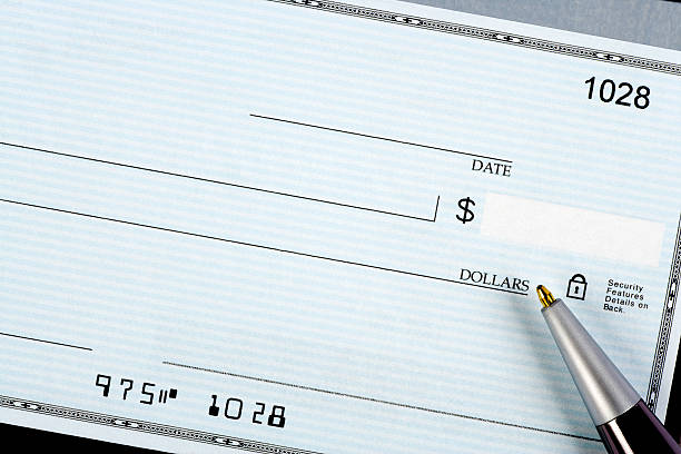 Blank check with pen stock photo