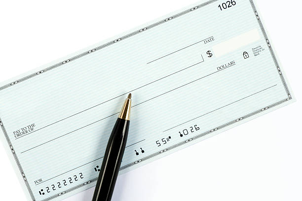 Blank check with pen stock photo