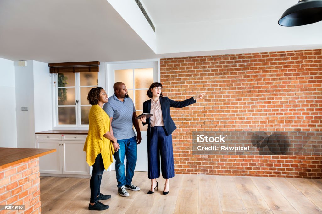 Black couple buy new house Real Estate Agent Stock Photo