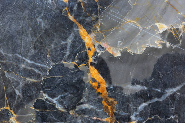istock White and gold patterned detailed of gray marble (Gold Russia) texture. Abstract dark background. 928721748