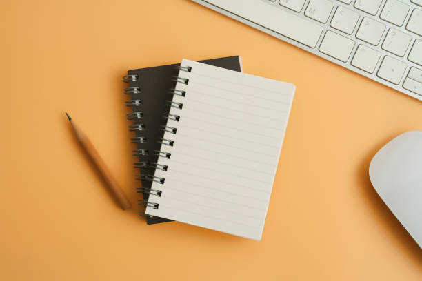 istock Styled stock photography brown office desk table with blank notebook, computer, supplies and coffee cup. Top view with copy space. Flat lay. 928721774