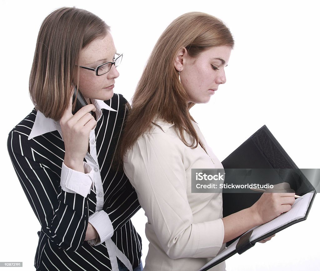 Due giovani donne di Business - Foto stock royalty-free di Abbigliamento elegante