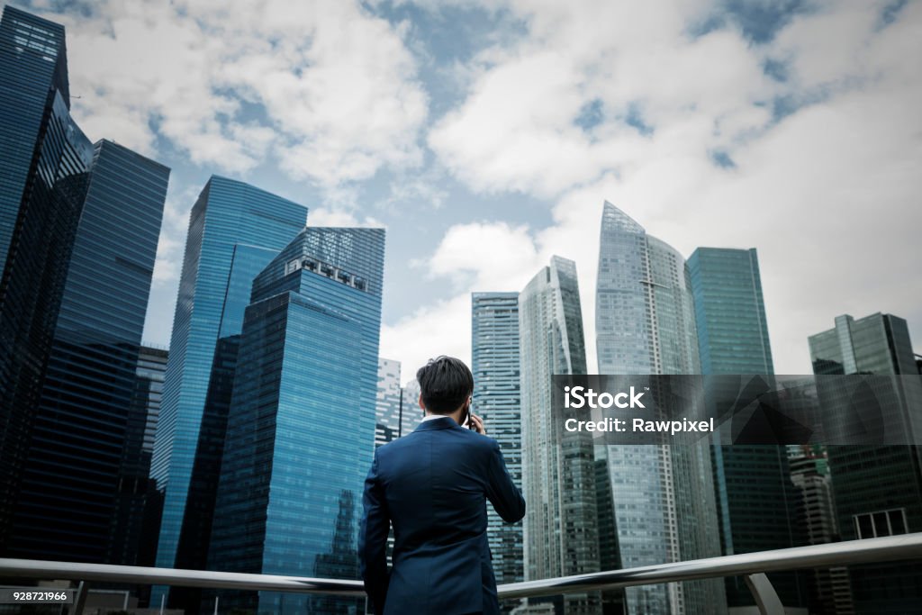 Asian businessman in a city Business Stock Photo