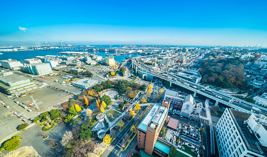 Asia Business concept for real estate and corporate construction - panoramic modern city skyline aerial view of Yokohama bayshore route expressway under blue sky in Yokohama, Japan