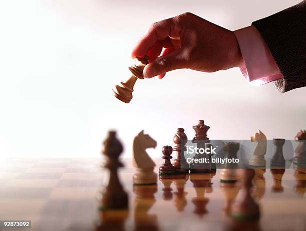 Wood Chess Board And Hand Holding Queen Stock Photo - Download Image Now - Boarding, Chess, Color Image