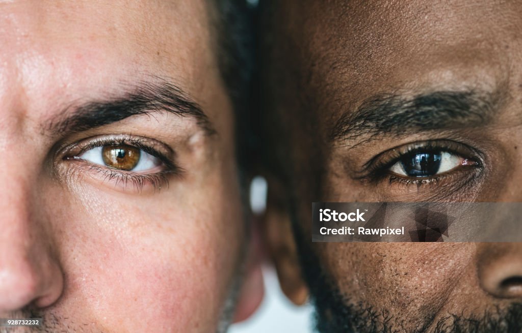 Two different ethnic men's eyes closeup Men Stock Photo