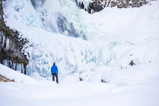 Man in 30’s on snowshoeing adventure near Whistler, British Columbia, Canada.