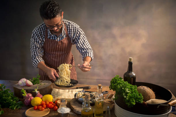 istock Man cook chef hipster with handsome bearded face in a hat 928743982