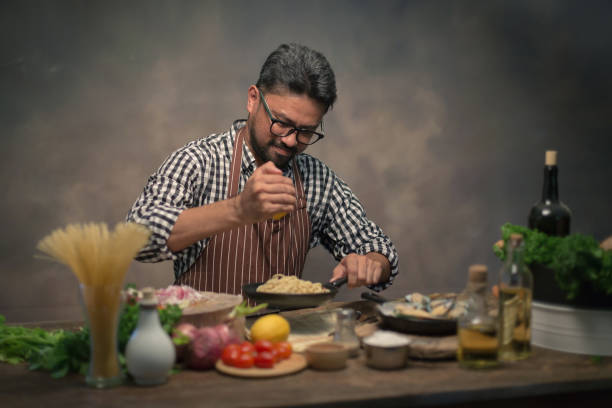 istock Man cook chef hipster with handsome bearded face in a hat 928743984