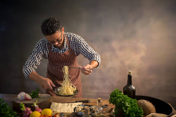 istock Man cook chef hipster with handsome bearded face in a hat 928743992