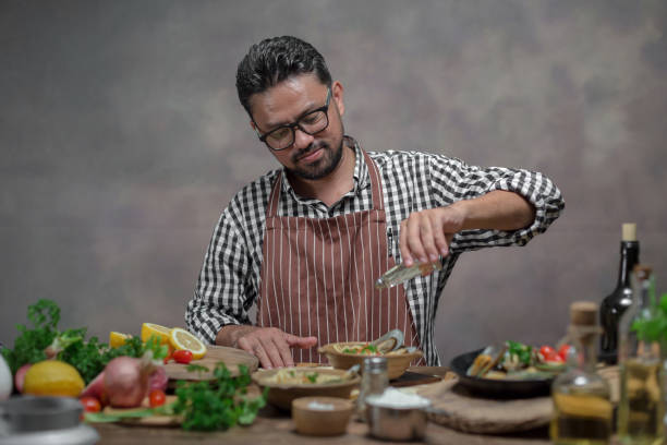 istock Man cook chef hipster with handsome bearded face 928744012