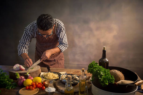 istock Man cook chef hipster with handsome bearded face in a hat 928744032