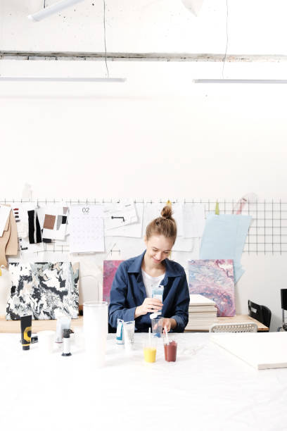 istock Girl artist, works in art Studio, acrylic, abstract, authenticity, DIY 928744052