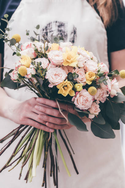 istock Florist holding bouquet beautiful flowers 928755594