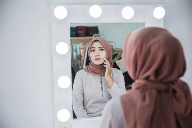istock unhappy feeling when looking face in the mirror 928759170
