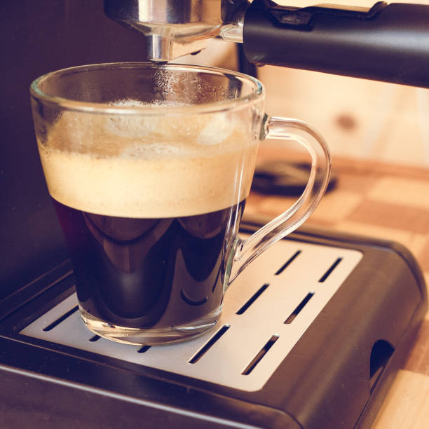 istock espresso machine pouring strong looking fresh coffee in a  glass cup. strong coffe 928762128