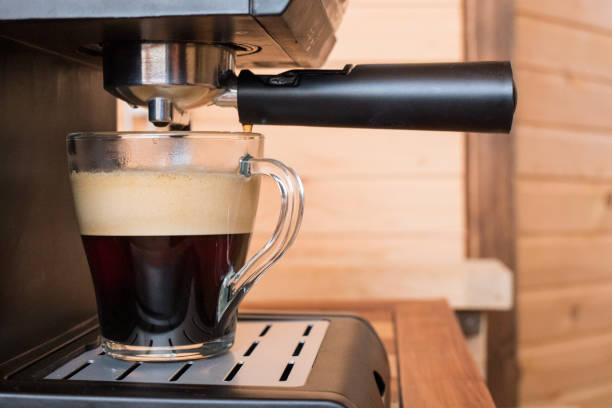istock espresso machine pouring strong looking fresh coffee in a  glass cup. strong coffe 928762192