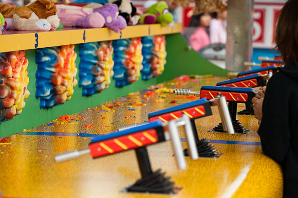 carnaval de juegos - pistola de agua fotografías e imágenes de stock