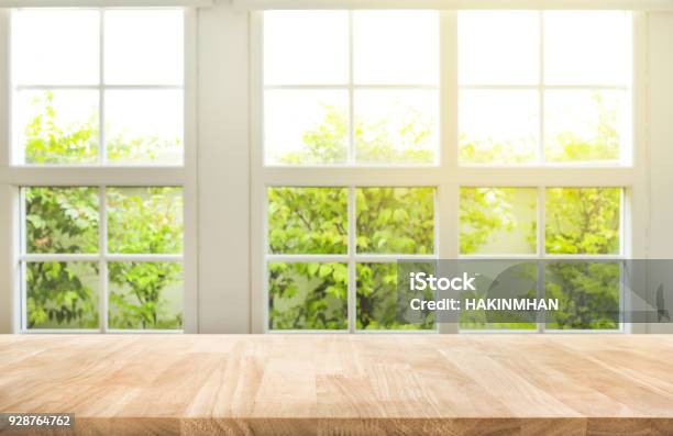 Top Of Wood Table Counter On Blur Window View Garden Background Stock Photo - Download Image Now