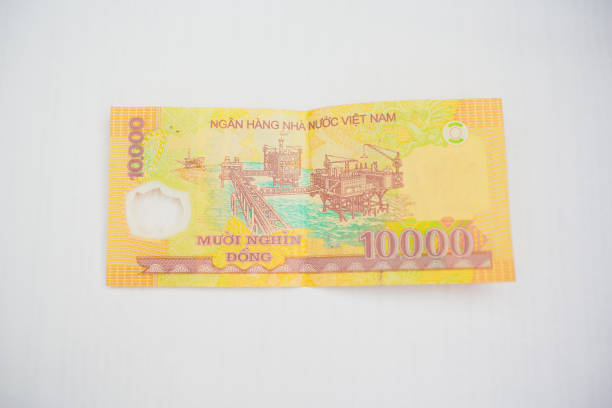 istock Vietnamese currency 10,000 dong banknote isolated on white background 928765018