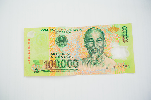 Vietnamese currency 100,000 dong banknote isolated on white background cash