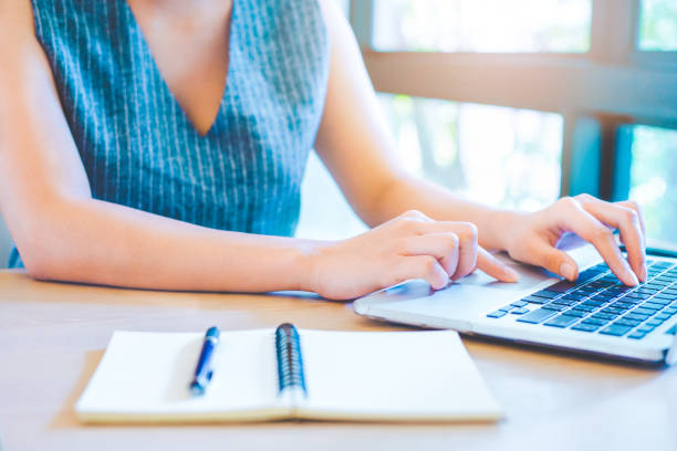 istock Business woman hand working with a laptop computer in the office. 928765202