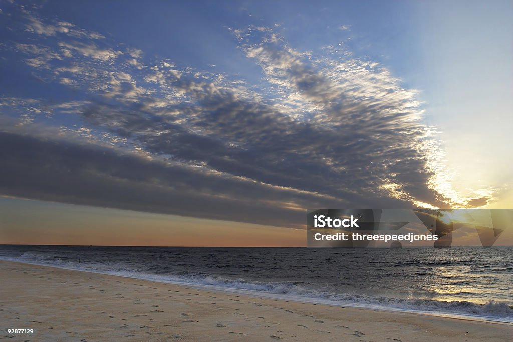 Ocean City Beach sunrise over the Atlantic Photo taken from the beach near Ocean City, Maryland. Sunrise with clouds. Landscape with horizontal composition. Ocean City - Maryland Stock Photo