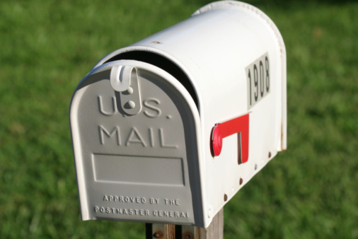 Closeup of a simple white mailbox