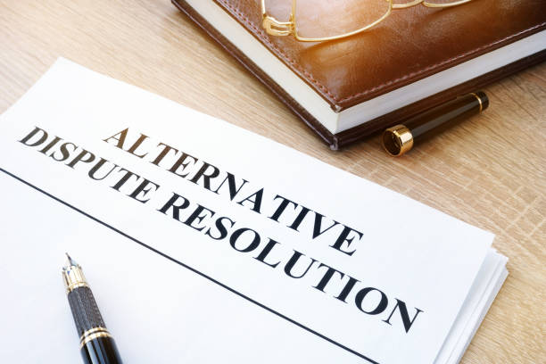 istock Documents with title alternative dispute resolution ADR in an office. 928775004