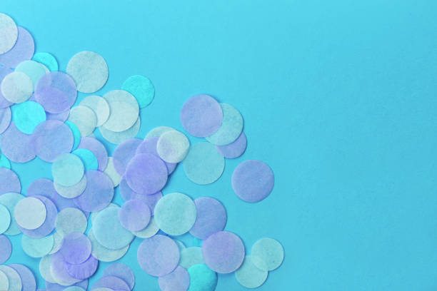 istock Blue confetti on pastel blue background. Festive background  for your design. 928775398
