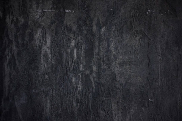 istock The stone wall concrete textured black background 928779416