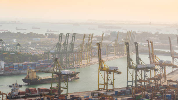 istock Container Cargo freight ship with working crane bridge in shipyard in singapore 928787078